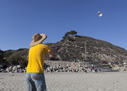 HIGH AS A ...:  Aaron Lockwood, who was part of Maeva and Aileen&rsquo;s wedding ceremony the day before Bill Murray&rsquo;s birthday, mastered the art of kite flying with only a few near-fatalities. - PHOTO BY COLIN RIGLEY