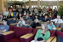CAL POLY GETS A LESSON IN HISTORY :  A packed Cal Poly University Union inauguration viewing. - PHOTO BY STEVE E. MILLER