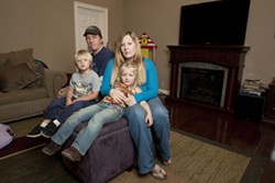 GETTING BY :  Molly O&rsquo;Leary and Ryan Risley are getting by now, but they don&rsquo;t know how they&rsquo;ll afford to stay at home with their kids if a $250-per-month sewer bill forces them both to work full time. - PHOTO BY STEVE E. MILLER