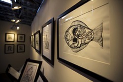 SOMETHING FISHY:  Joseph Kalionzes taught himself printmaking techniques, and his works are pulled from hand-carved linoleum and wood blocks. - PHOTO BY KAORI FUNAHASHI