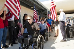 WELCOME! :  Wounded American and British war veterans arrived Sept. 25 at the SLO Regional Airport for Operation Surf, a rehabilitative surfing program. - PHOTOS BY STEVE E. MILLER