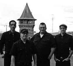 FOLSOM PRISON BLUES:  Johnny Cash tribute act Cash&rsquo;d Out, shown here in front of Folsom Prison, returns to SLO Brew on March 21. - PHOTO COURTESY OF CASH&rsquo;D OUT