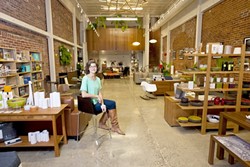 DESIGNING SLO :  Carla Wingett, manager of Atmodsphere, offers quality home products. - PHOTO BY STEVE E. MILLER