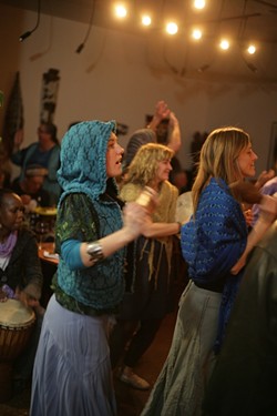 BLISS OUT!:  The energy in the room is palpable as attendees dance for rain. - PHOTO BY GLEN STARKEY