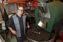 LOCAL ROAST:  Phil Grant, Roastmaster for Coastal Peaks Coffee, roasts coffee with knowledge and pride for customers all over the Central Coast. - PHOTO BY STEVE E. MILLER