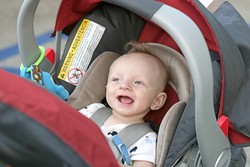 HIS FIRST ART SHOW! :  Six-month-old Bode Maire is all smiles at his first art show. - PHOTO BY GLEN STARKEY