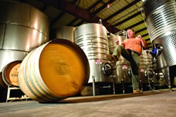 KICKIN&rsquo; IT :  Mike Sinor, one of many winemakers participating in the annual Roll Out the Barrels celebration, showcased his barrel rolling skills for New Times. - PHOTO BY STEVE E. MILLER