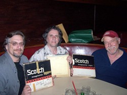 COLLABORATORS :  (Left to right) Brother Records, Inc. Beach Boys archivist Alan Boyd, Brian Wilson producer Mark Linett, and local singer-songwriter Lance Robison hold the three tapes Capitol and Brother Records used to release new stereo re-masters of two classic Beach Boys tracks on Summer Love Songs. - PHOTO COURTESY OF LANCE ROBISON