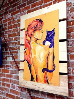 CAT LADY:  Sara LeGrady's vibrant paintings adorned the walls of Tigerlily Salon as part of SLO's Art After Dark. - PHOTO BY JESSICA PE&Ntilde;A