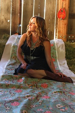 SHE'S THE ONE:  Natalie Haskins (pictured) joins fellow singer-songwriters Joe Koenig and Jon Clarke at Broken Earth Winery on March 28. - PHOTO BY MARISSA KNUCKLES