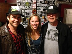 THANK YOU, GOOD MEDICINE PRESENTS!:  Willie Nelson&rsquo;s son Lukas Nelson (left), Good Medicine Presents co-owner Korie Newman (center), and iconic rocker Neil Young (right) joined forces to play a last minute, secret concert at SLO Brew. - PHOTO BY GLEN STARKEY