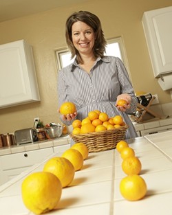 HEALTHY CHOICE :  To help Oceano Elementary School students concentrate on nourishing foods, Kelly Lynch employs such tactics as a ballot for tangerines versus oranges. - PHOTO BY STEVE E. MILLER