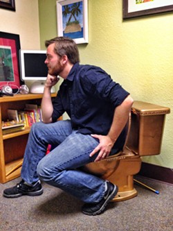 DEEP THUNKER:  This is Nick Powell, sitting on the office toilet. He wanted to write something about a poop joke here. - PHOTO BY STEVE E. MILLER