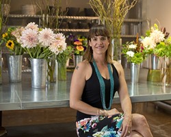EVERYONE LOVES FLOWERS:  Clover and Branch owner Carrie Skelton plays host to a flower fest every Friday in her floral studio, with fresh flower arrangements that&rsquo;ll look great anywhere you put them. - PHOTO BY STEVE E. MILLER
