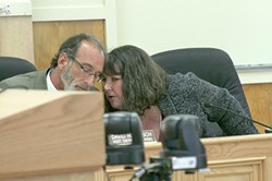IN HOT WATER :  Embattled Cambria Community Services District General Manager Tammy Rudock (pictured, right) conferred with Assistant District Counsel David Hirsch after being berated by angry residents at an April 28 board meeting. - PHOTO BY MATT FOUNTAIN