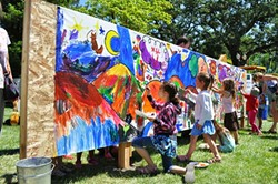 IN SITU:  ARTSFEST attendees add to a communal mural. - PHOTO COURTESY OF STUDIOS ON THE PARK