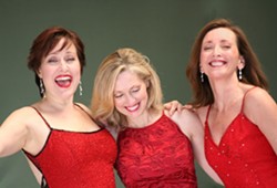 RED AS SANTA:   Karen Culliver, Mary D&rsquo;Arcy, and Teri Bibb put on a show that embodies the holly, jolly spirit of the season. - PHOTO COURTESY OF THE PHANTOM&rsquo;S LEADING LADIES