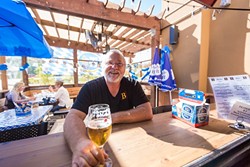 THE BIER MAN :  Beda Schmidthues and his wife, Helga, are pouring their heart, soul, and delicious family recipes into the hearty offerings at Beda&rsquo;s Biergarten. - PHOTO BY KAORI FUNAHASHI