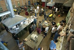 BUSY PIRATE BEES :  The metal shop buzzed with activity as the class came to a close. - PHOTO BY STEVE E. MILLER