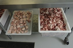 4: :  The tray on the left is pancetta for the Buona Tavola restaurants and the tray on the right is shoulder and leg meat that will be used in the salami production.