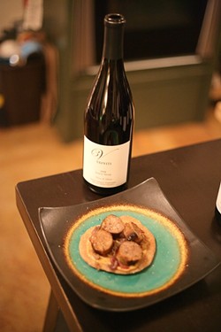 COURSE THREE :  Apple sausage over homemade flatbread with caramelized onions and stone ground mustard goes great with the silver medaled 2008 Pinot Noir. - PHOTO BY GLEN STARKEY