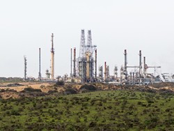 SOMETHING BREWING:  Though a proposal to transport oil by rail to the Phillips 66 Santa Maria Refinery in Nipomo (pictured) is still under - evaluation, some recently filed lawsuits against Phillips 66 could portend a legally thorny future for the project. - FILE PHOTO BY KAORI FUNAHASHI