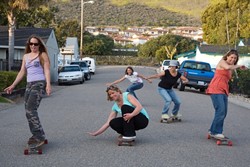 ROLLIN WITH THE SISTERS :  Surf Sisters (left to right) Jennifer Jozwiak, Deby Hansen (crouching), Christy Serpa (background), Colleen Gnos, and Jennifer Blonder want to show you movies for the good of the ocean. - PHOTO BY JESSE ACOSTA