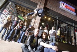 GREAT SKATE! :  Co-owners Jono and Stephanie Hicks (foreground) recently opened Coalition, a skate shop in San Luis Obispo. Behind them are (left to right) Jessica, Neil, John (in the window), Sophie, Danielle, Tyler, Joel, Erica, and John. Oh, and Ken in the air. - PHOTO BY STEVE E. MILLER
