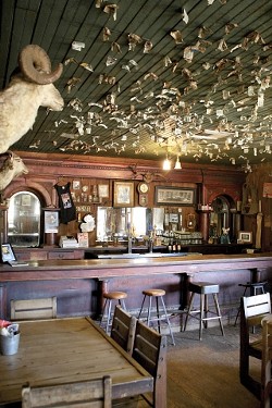 RUSTIC CHARM :  Little has changed about the Pozo Saloon since it was constructed nearly 150 years ago. The interior is decorated with period artifacts, including a little pistol that the owners found while tilling the back field. - PHOTO BY STEVE E. MILLER