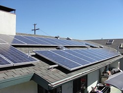 POWER TO THE PEOPLE:  Jeff Oldham of Los Osos powers his home, workshop, Jacuzzi, and more with this 30-panel, 5-kilowatt solar power system, and still has enough energy left over to plug in his neighbors Christmas lights.