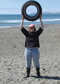 TONS OF TRASH :  Kathi DiPeri reveals the sort of trash found at Cayucos Beach. Cleaning up local beaches is a popular annual event for around 1,500 volunteers, with Sept. 15 set for this year's Coastal Cleanup Day. - PHOTO COURTESY OF/COPYRIGHT GAIA GRAPHICS & ASSOCIATES