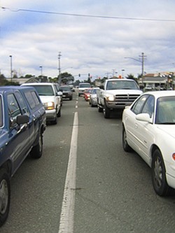 TIRED OF WAITING :  Traffic piles up daily on Nipomos West Tefft Street, as commuters wait to enter Highway 101, but congestion may clear if the San Luis Obispo County Board of Supervisors approves the neighborhoods new design plan. - PHOTO BY JEANINE STEWART