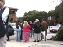 TWO GROUPS :  Demonstrators regularly gather outside of San Luis Obispos Planned Parenthood office, which prompts volunteers (such as the one in the black vest at left) to escort women seeking abortions in and out of the building. - PHOTO CONTRIBUTED