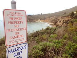 KEEP OUT:  The California Coastal Commission sent a stern letter of warning to the city of Pismo Beach over these signs, which they say could discourage public access to the bluffs and trails near Pirate&rsquo;s Cove. - PHOTO BY CHRIS MCGUINNESS