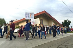 MESSAGE OF HOPE:  Several prayer walks have occurred in Santa Maria following the increase in gang violence, including one led by the Santa Maria Foursquare Church on Jan. 17 (pictured), and another led by Victory Outreach on Jan. 30. - PHOTO COURTESY OF TIM MOSSHOLDER