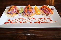 FLAVOR, COLOR, TEXTURE:  Street Side Ale House&rsquo;s snapper tacos with house slaw, macerated onions, pickled veggies, and chipotle Thousand Island dressing are perfect for a fresh meal on a hot Atascadero afternoon. - PHOTO BY DYLAN HONEA-BAUMANN