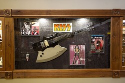 FEEL THE MUSIC:  A guitar once owned and signed by Gene Simmons of KISS hangs on the wall at Gary Kramer Guitar Cellars in Paso Robles. - PHOTO BY JAYSON MELLOM