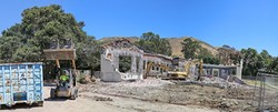 IN WITH THE NEW:  Just weeks before school starts in August, construction workers tear down San Luis Obispo High School&rsquo;s old annex building. In its place will be a new 12-classroom building. - PHOTO BY DYLAN HONEA-BAUMANN