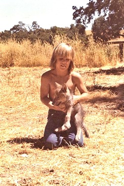 RANCH DAYS:  Young Josh Brolin on his Paso Robles-area family ranch with a canine. - PHOTO COURTESY OF JOSH BROLIN