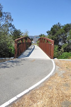 ENTER HERE!:  This pedestrian and bike bridge on the corner of Prado Road leads to the newest segment of the Bob Jones Trail that will eventually connect to Avila Beach. - PHOTO BY GLEN STARKEY