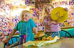 BURGER TOWN:  Bodie Read, 5, and his sister Lila Read, 2, enjoy a kids meal at Sylvester&rsquo;s Burgers, the best place to take your child to for a burger and fries (and there&rsquo;s beer for you, too!). - PHOTO BY JAYSON MELLOM