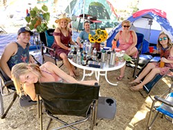 LIVE OAKIES! (Clockwise from bottom) Rakesha, Casey, Melinda, Ryan, Anna, and Micki find a shady spot during a hot 29th annual Live Oak Music Festival. - PHOTO BY GLEN STARKEY