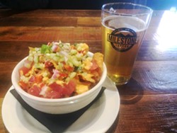 MILESTONE TAVERN Appetizers like poke nachos and local beer like Barrelhouse's Mango IPA is where it's at when dining at Milestone Tavern. - PHOTO BY RYAH COOLEY