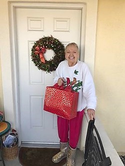 SPREADING JOY Dressed to impress in her holiday gear, Eden received a gift from the Be a Santa to a Senior program. - PHOTO COURTESY OF GINA PERRAULT