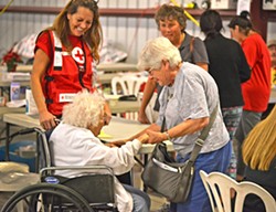 SAFE Charlotte Marchetti (left) and Carol Daly (right) reunite at a shelter after evacuating their homes in Ventura five days earlier. - PHOTO BY DERMOT TATLOW COURTESY OF THE RED CROSS