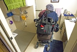 ACCESSIBLE HOME Ramirez showed New Times her wheelchair-accessible one-bedroom apartment, which she pays less than $300 in rent for. The Housing Authority of SLO recently filed for eminent domain to purchase the Brizzolara Apartments from AIG investors. - PHOTO BY JAYSON MELLOM