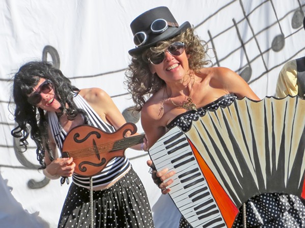 BE A GOOF Liz Rhoads Cordoba and Marianne Orme have fun with the backstage green room props ... because everyone's a kid at the Live Oak Music Festival. - PHOTO COURTESY OF MARIANNE ORME AND LIZ RHOADS CORDOBA