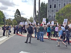 JANUS IMPACT Members of Cal Poly's faculty union march on campus in 2016. A recent decision by the U.S. Supreme Court will ban public sector unions like this one from collecting fees from nonmembers. - FILE PHOTO BY CHRIS MCGUINNESS