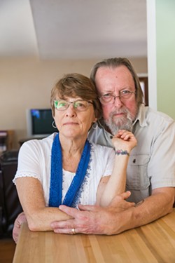 PAYING TRIBUTE Kim Lacey, of Atascadero, with her husband, Dan Grahm, in their home, shows her tattoo that she got in memory of her son Ty after he overdosed on heroin in 2016. - PHOTO BY JAYSON MELLOM