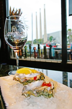 ON THE HALF SHELL Oysters on the half shell, local wine, and a beachy view? This is real life at Stax Wine Bar in Morro Bay. Owned by Giovanni DeGarimore of Giovanni's Fish Market &amp; Galley, Stax is able to offer up fresh seafood whenever a good catch is hauled in from the bay. - PHOTO COURTESY OF REID CAIN